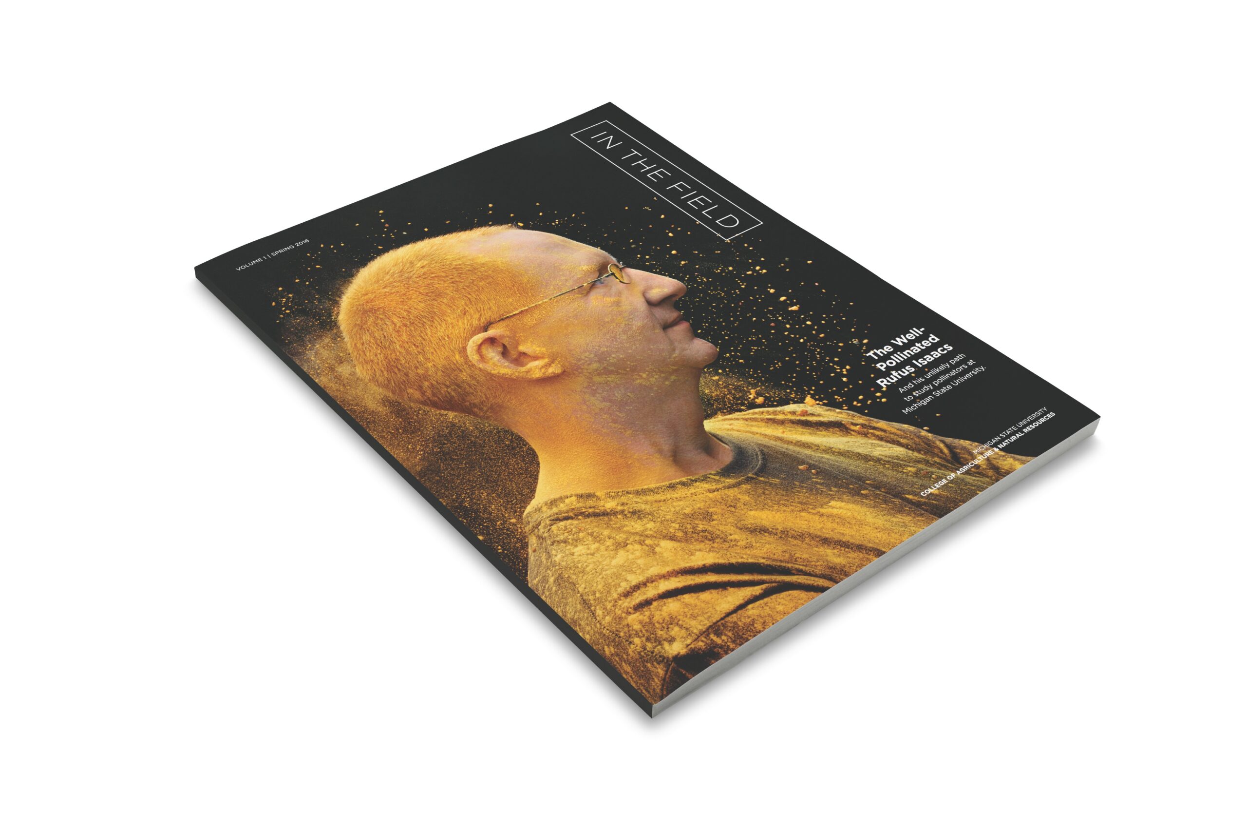 An image of the front cover of In the Field magazine which is a magazine for the College of Agriculture and Natural Resources at Michigan State University. The cover showcases Rufus Issacs, a bee pollen researcher with what looks like bee pollen surrounding his head.